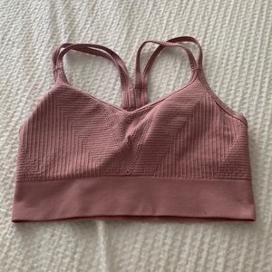 Pink sports bra from target, cute details, super soft.